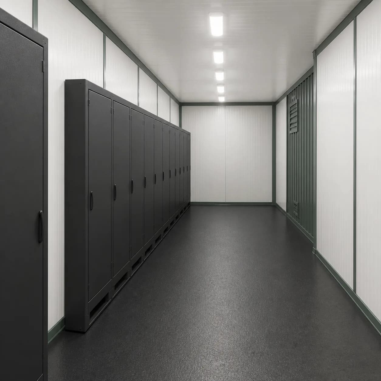 Closed equipment cabinet run beside the central service aisle inside a 20 ft BESS enclosure