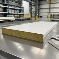 Cut section of a SAMAN rockwool panel showing the stone wool core on the QC table