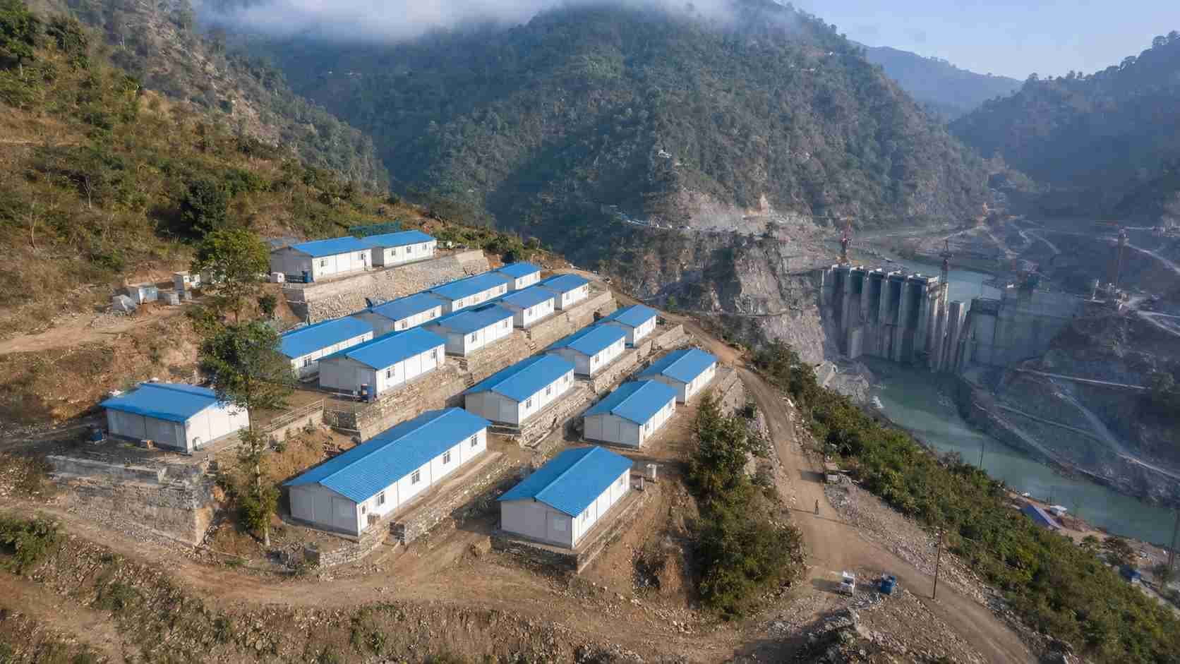 SAMAN labor cottages at an Indian hydropower dam project site on stepped levelled platform in hilly terrain