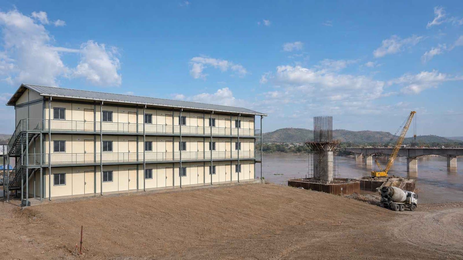 G+2 SAMAN labor shelter block on a river bank near a bridge construction project in rural India