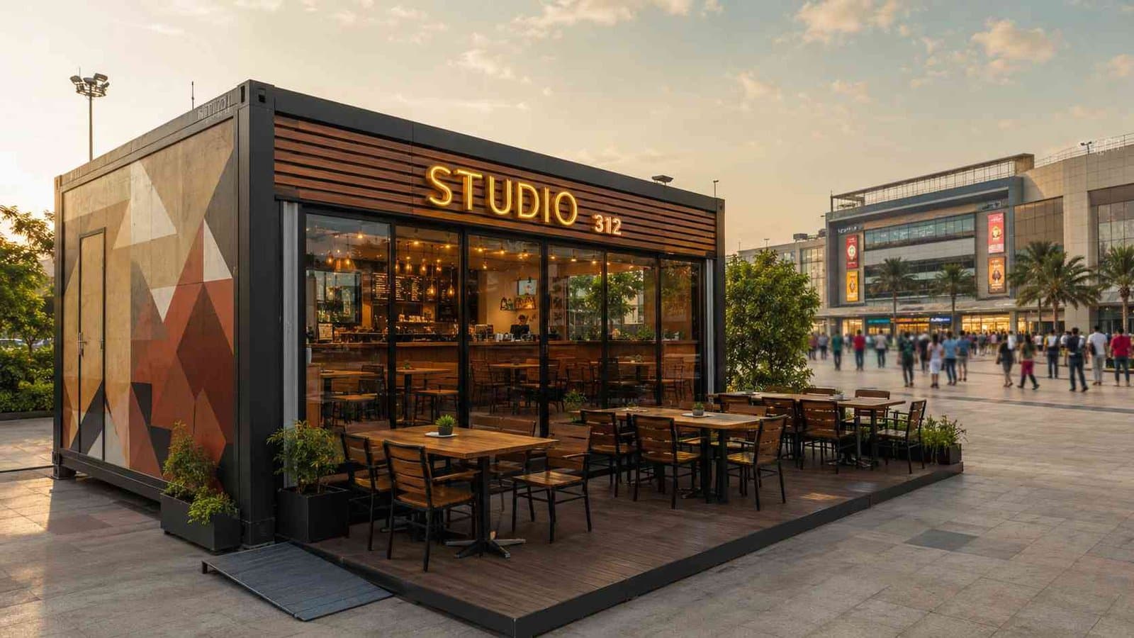 22×12 mobile restaurant container at a mall forecourt with customised vinyl-wrap exterior — outdoor terrace seating ready for trade