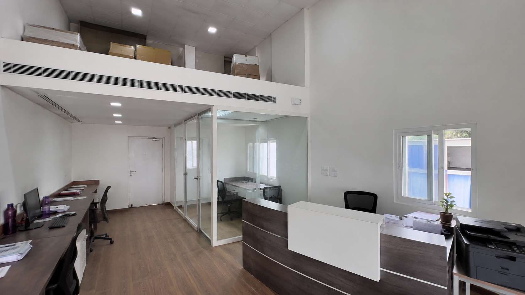 Interior of a modular office building showing the 11-ft height, storage loft and ducted AC.