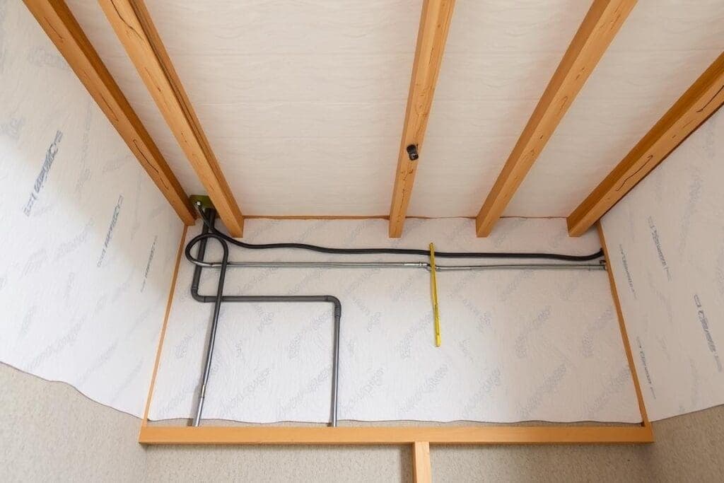 Interior structure showing insulation and electrical systems in labour colony Interior structure showing insulation and electrical systems in labour colony