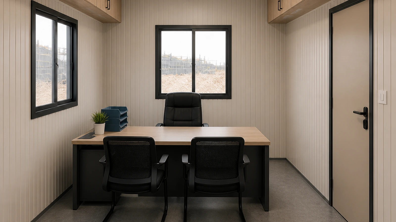 The partitioned 10 × 10 ft manager room in the 40 × 10 ft site cabin, window, desk and internal door