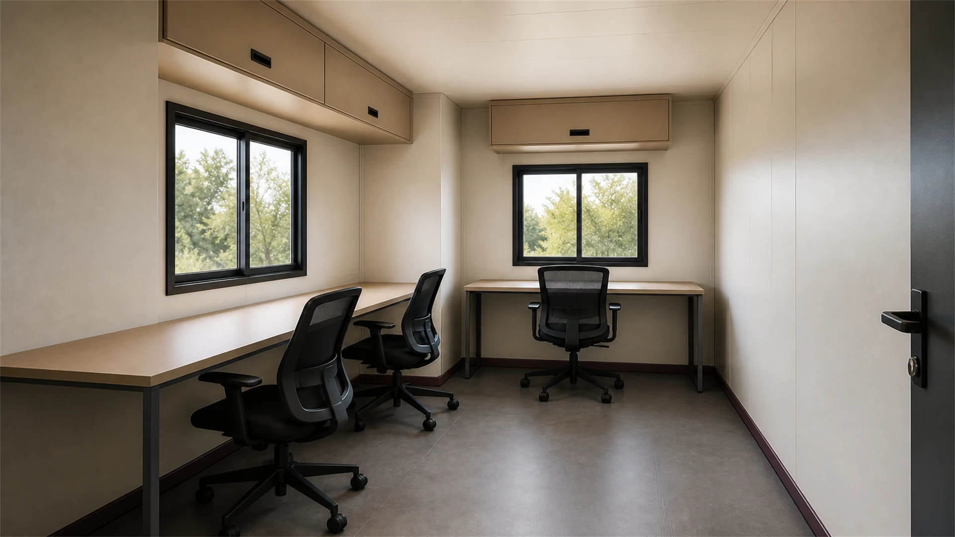 Interior of a flat-pack container office with two desks, three chairs, overhead cabinets and two sliding windows
